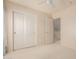 Bedroom featuring a closet and an open doorway showing the staircase at 16228 W Crocus Dr, Surprise, AZ 85379