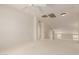 Versatile bonus room with neutral paint, carpet, ceiling fan, and plenty of natural light at 16228 W Crocus Dr, Surprise, AZ 85379