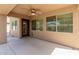 Covered patio with ceiling fan, providing a comfortable outdoor living space at 16228 W Crocus Dr, Surprise, AZ 85379
