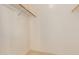 Walk-in closet with carpet and wood rods and shelving for ample storage space at 16228 W Crocus Dr, Surprise, AZ 85379
