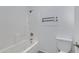Bright bathroom with a shower-tub combo and modern toilet at 17812 N Carmen Ave, Maricopa, AZ 85139