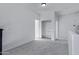 Bright bedroom with carpet and walk-in closet featuring ample storage space at 17812 N Carmen Ave, Maricopa, AZ 85139