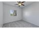 Bright bedroom featuring neutral walls, carpet, and a ceiling fan at 17812 N Carmen Ave, Maricopa, AZ 85139