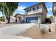 Inviting two-story home with a two-car garage and a well-kept driveway in a friendly community at 17812 N Carmen Ave, Maricopa, AZ 85139