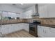 Modern kitchen featuring stainless steel appliances, updated cabinetry, and a gas range for cooking enthusiasts at 17812 N Carmen Ave, Maricopa, AZ 85139