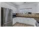 Contemporary kitchen with stainless steel appliances, granite countertops, and ample storage space for cooking at 17812 N Carmen Ave, Maricopa, AZ 85139