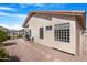 Cozy backyard patio with gravel, stepping stones, and low-maintenance landscaping at 18163 W Addie Ln, Surprise, AZ 85374