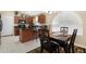 Eat-in kitchen with wooden cabinets, granite countertops and stainless steel appliances at 18163 W Addie Ln, Surprise, AZ 85374