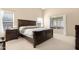 Cozy main bedroom with comfortable queen-sized bed and neutral decor at 18163 W Addie Ln, Surprise, AZ 85374