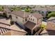 An aerial shot showcasing the house's layout, roofline, and yard at 1930 W Yellowstone Way, Chandler, AZ 85248