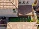 Aerial view of backyard with artificial turf and a brown tile roof at 1930 W Yellowstone Way, Chandler, AZ 85248