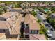 An aerial view of a community featuring well-maintained homes with tile roofs and lush landscaping at 1930 W Yellowstone Way, Chandler, AZ 85248