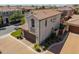 Aerial view of a home with tile roof, mature landscaping and brick paved driveway at 1930 W Yellowstone Way, Chandler, AZ 85248