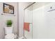 Bright bathroom featuring a glass shower, toilet, and decorative wall art at 1930 W Yellowstone Way, Chandler, AZ 85248