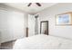 Neutral bedroom with a ceiling fan, a comfortable bed, closet space, and lots of natural light at 1930 W Yellowstone Way, Chandler, AZ 85248