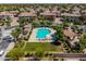 Aerial view showcasing community pool, spa, seating, manicured green spaces, and desert landscaping at 1930 W Yellowstone Way, Chandler, AZ 85248