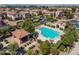 An aerial view of the community pool area with seating, landscaping, and neighborhood homes at 1930 W Yellowstone Way, Chandler, AZ 85248