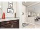 Welcoming entryway features stylish decor, granite countertop, and a view of the home's open-concept living space at 1930 W Yellowstone Way, Chandler, AZ 85248