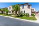 Charming stucco home with a well-manicured lawn and lush landscaping at 1930 W Yellowstone Way, Chandler, AZ 85248