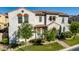 Stunning two-story home featuring stucco siding, tile roof, arched entryway, and lush landscaping at 1930 W Yellowstone Way, Chandler, AZ 85248