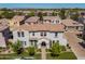 Stunning two-story home featuring a tile roof, manicured lawn, and charming landscaping in a peaceful neighborhood setting at 1930 W Yellowstone Way, Chandler, AZ 85248