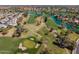 Aerial view of a lush green golf course with surrounding water features and residential homes at 1930 W Yellowstone Way, Chandler, AZ 85248