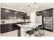 Stylish kitchen boasting granite countertops, stainless steel appliances, ample cabinetry, and barstool seating at 1930 W Yellowstone Way, Chandler, AZ 85248