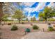 Landscaped backyard features desert landscaping, lush greenery, and views at 2146 S Drexel --, Mesa, AZ 85209