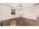 Spacious bedroom featuring gleaming hardwood floors and a modern ceiling fan at 2146 S Drexel --, Mesa, AZ 85209