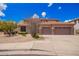 Charming two-story home features a spacious three-car garage and desert landscaping at 2146 S Drexel --, Mesa, AZ 85209