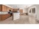 Open kitchen with wooden cabinets, stainless steel appliances, tiled backsplash, and breakfast bar with stools at 2146 S Drexel --, Mesa, AZ 85209