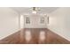 Spacious living room with wood floors, ceiling fan, and ample natural light from the two windows at 2146 S Drexel --, Mesa, AZ 85209