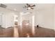 Open living space with hardwood floors, staircase, and views to a bathroom area at 2146 S Drexel --, Mesa, AZ 85209