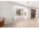 Bright living room featuring a large bay window, neutral paint, and tiled floors at 2146 S Drexel --, Mesa, AZ 85209