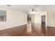 Bright main bedroom with wood floors, a ceiling fan, and a sliding glass door at 2146 S Drexel --, Mesa, AZ 85209