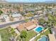 Expansive aerial shot showcasing neighborhood homes with pools, solar panels, and well-manicured lawns at 2315 E Cholla St, Phoenix, AZ 85028
