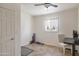 Flex bedroom with tile floor, ceiling fan, desk, and neutral-colored walls at 2315 E Cholla St, Phoenix, AZ 85028