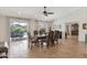 Elegant dining room with decorative tile flooring, an ornate wood table, and backyard pool views at 2315 E Cholla St, Phoenix, AZ 85028