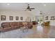 Expansive living room with a ceiling fan, tile flooring, and a view of the backyard swimming pool at 2315 E Cholla St, Phoenix, AZ 85028