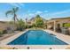 Inviting backyard pool with lounge chairs, mountain views, and mature trees at 2315 E Cholla St, Phoenix, AZ 85028