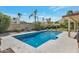Refreshing pool with desert landscaping, palm trees, and blue skies at 2315 E Cholla St, Phoenix, AZ 85028