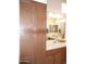 Bathroom featuring light countertop, wood cabinetry and wall length vanity cabinet at 2401 E Rio Salado Pkwy # 1225, Tempe, AZ 85288