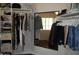 Well-organized closet with rods, shelves, and a mirror for added convenience at 2401 E Rio Salado Pkwy # 1225, Tempe, AZ 85288