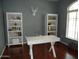 Clean and organized office with white desk, chair, and shelving at 2401 E Rio Salado Pkwy # 1225, Tempe, AZ 85288