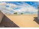 Expansive backyard featuring block fence for privacy and potential for customized landscaping at 24356 W La Salle St, Buckeye, AZ 85326