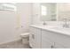 Well-lit bathroom with double sinks set in white cabinets and modern fixtures, offering both style and functionality at 24356 W La Salle St, Buckeye, AZ 85326