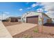 Beautiful single-story home with a two-car garage, paver driveway, and low-maintenance rock landscaping at 24356 W La Salle St, Buckeye, AZ 85326