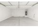 Spacious two car garage featuring a concrete floor and neutral paint colors at 24356 W La Salle St, Buckeye, AZ 85326