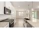 A modern kitchen featuring white cabinets, an island, and stainless steel appliances at 24356 W La Salle St, Buckeye, AZ 85326