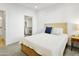 A comfy bedroom featuring a bed, side table, and an open view to the closet at 2511 W Queen Creek Rd # 165, Chandler, AZ 85248